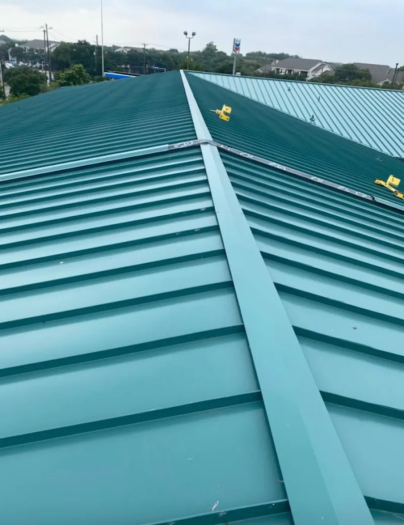 Green commercial metal roof ridge and valley for Metal Roof Repair in Oakton